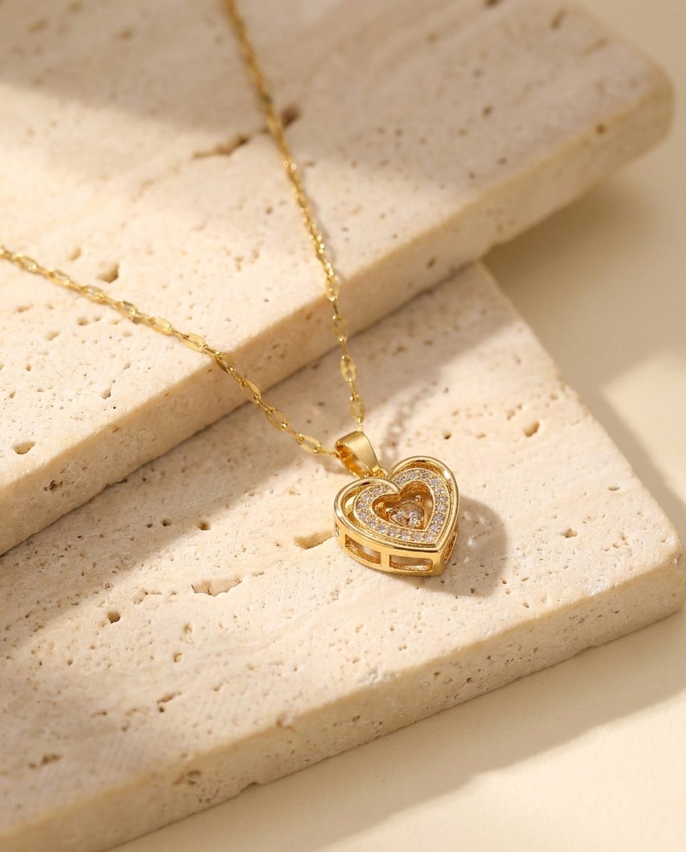 Gold pave heart necklace on a fine lace link chain