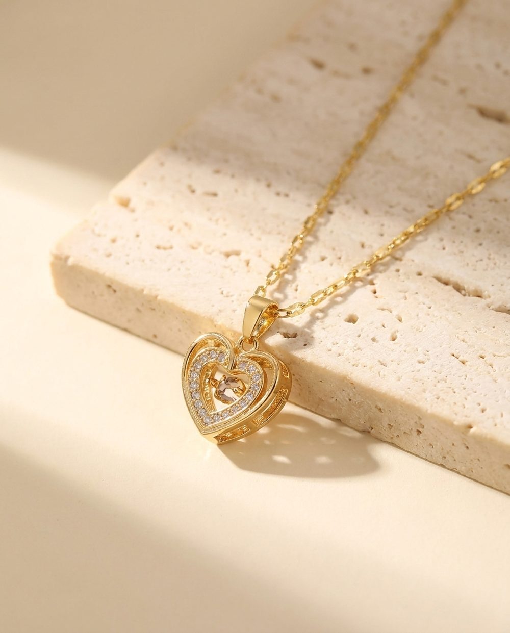 Gold double heart necklace with floating crystal centre